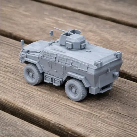 Gray 3D-printed model of an armored infantry mobility vehicle on a wooden surface.