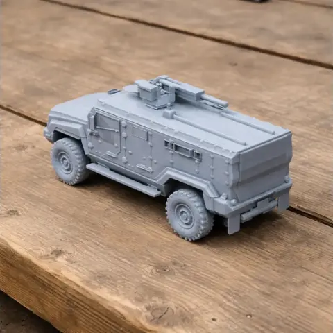 A detailed 3D printed model of a Kamaz Typhoon military vehicle on a wooden surface.