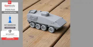 Gray 3D-printed armored vehicle model with six wheels, displayed on a wooden surface.