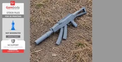 3D printed AK-9 cosplay prop lying on dry grass and soil.