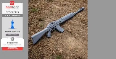 A 3D printed gray AN-94 rifle prop lying on dry ground with sparse grass.