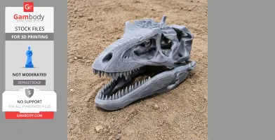 3D-printed Teratophoneus skull model on sandy ground, showing detailed teeth and eye sockets.