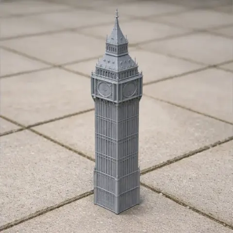 3D printed model of Big Ben, featuring detailed architecture on a tiled surface.