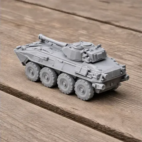 A detailed 3D-printed model of an LAV-300 armored vehicle on a wooden surface.
