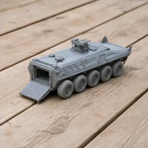 A detailed 3D-printed model of an armored vehicle with eight wheels and an open rear ramp.