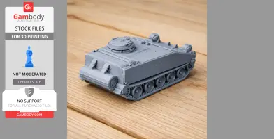 3D printed M114 armored fighting vehicle model on a wooden surface.