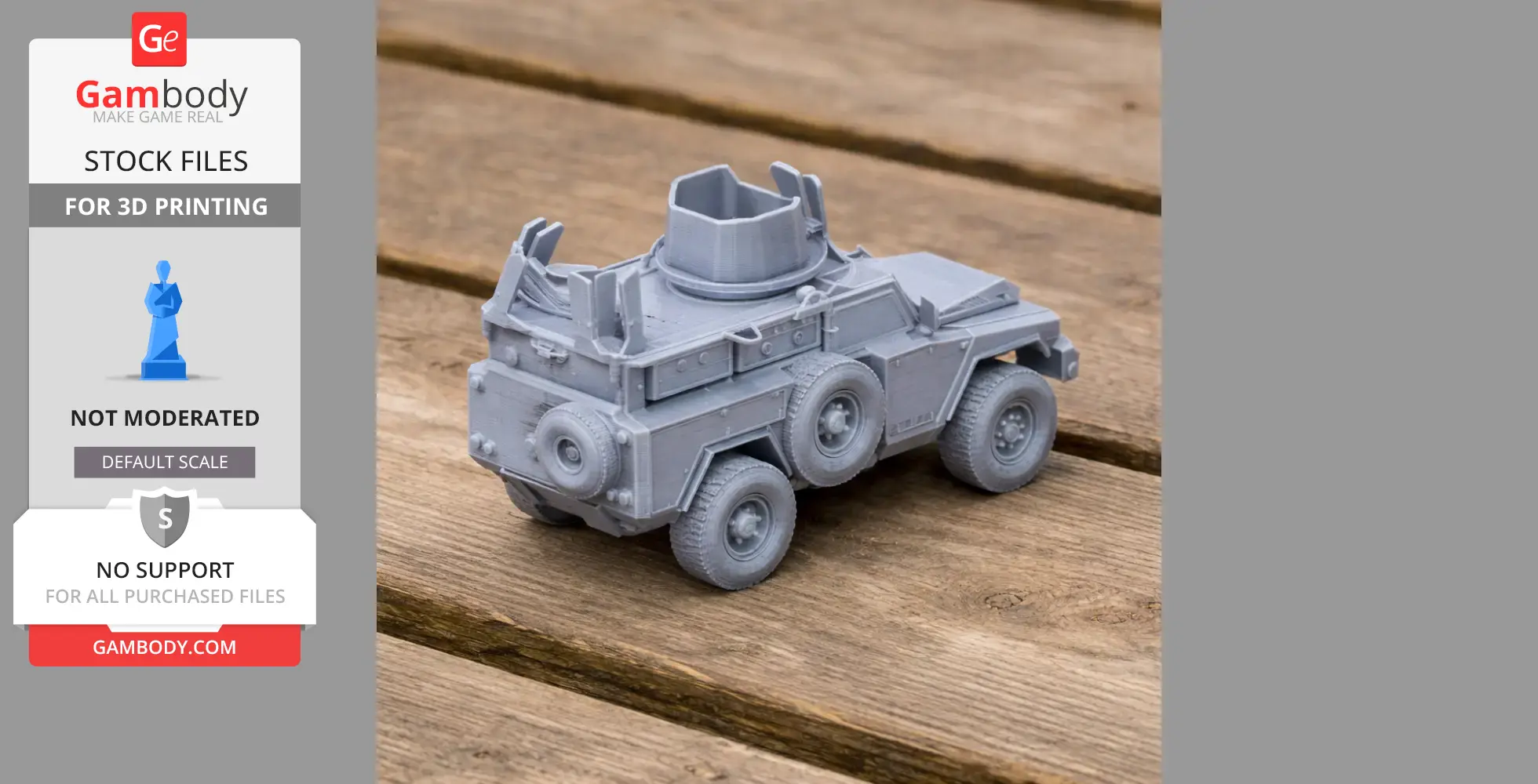 Gray 3D-printed model of a Mamba APC tank on a wooden surface, showcasing wheels and turret detail.