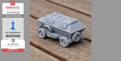 Gray 3D-printed MAP75 armored personnel carrier model on wooden surface.