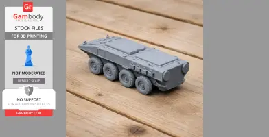 A gray 3D-printed eight-wheeled marine personnel carrier tank model on a wooden surface.