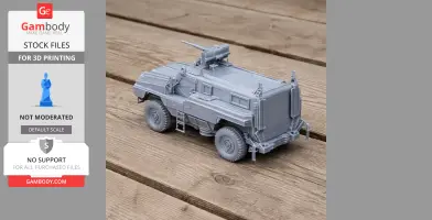 A detailed 3D-printed model of a Matador mine-protected vehicle on a wooden surface.