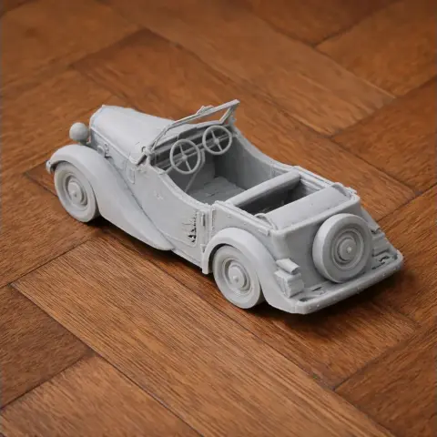 3D printed model of a vintage convertible car with two seats and a spare tire on the back.