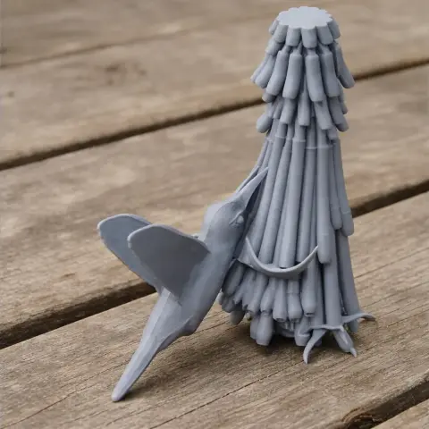 A gray 3D-printed model of a bird with elongated wings perched on a tree-like structure.