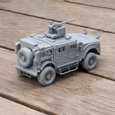 A detailed 3D-printed model of a mine-resistant ambush protected vehicle with mounted weaponry.