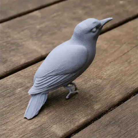 3D printed model of a bird with detailed feathers, perched on a wooden surface.