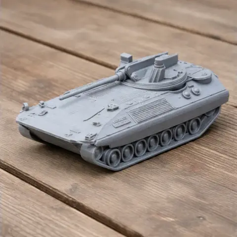 A 3D printed model of a Mowag Trojan infantry fighting vehicle with detailed tread and turret on a wooden surface.