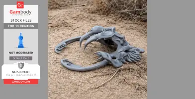 A 3D-printed timber rattlesnake skull replica on sandy ground, showcasing fangs and intricate bone structure.