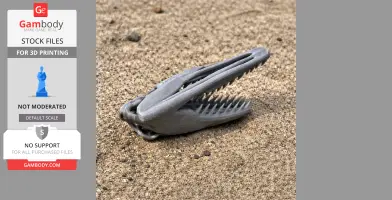 3D-printed Timurlengia dinosaur skull replica with sharp teeth, displayed on sandy ground.