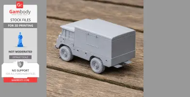 Gray 3D-printed model of a Mowag T1 4×4 military vehicle on wooden surface.