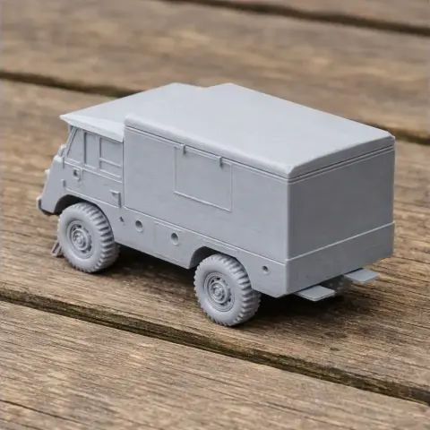 3D-printed model of a Mowag T1 4x4 military vehicle on a wooden surface.