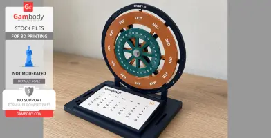 A mechanical desk calendar with rotating date and month rings on a wooden table.