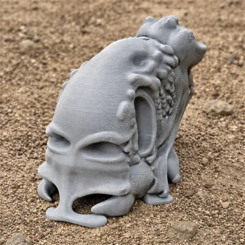 Intricate, gray Triassolestes skull replica on sandy ground, designed for 3D printing.