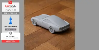 A 3D-printed model of a De Tomaso Vallelunga car on a wooden surface.