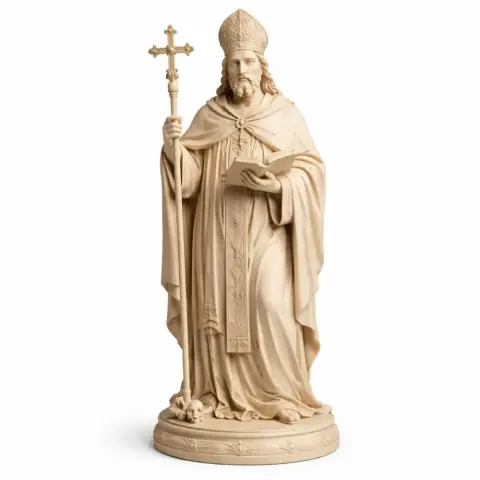A detailed statue of a bearded saint holding a cross and book, wearing a bishop’s hat and robes.