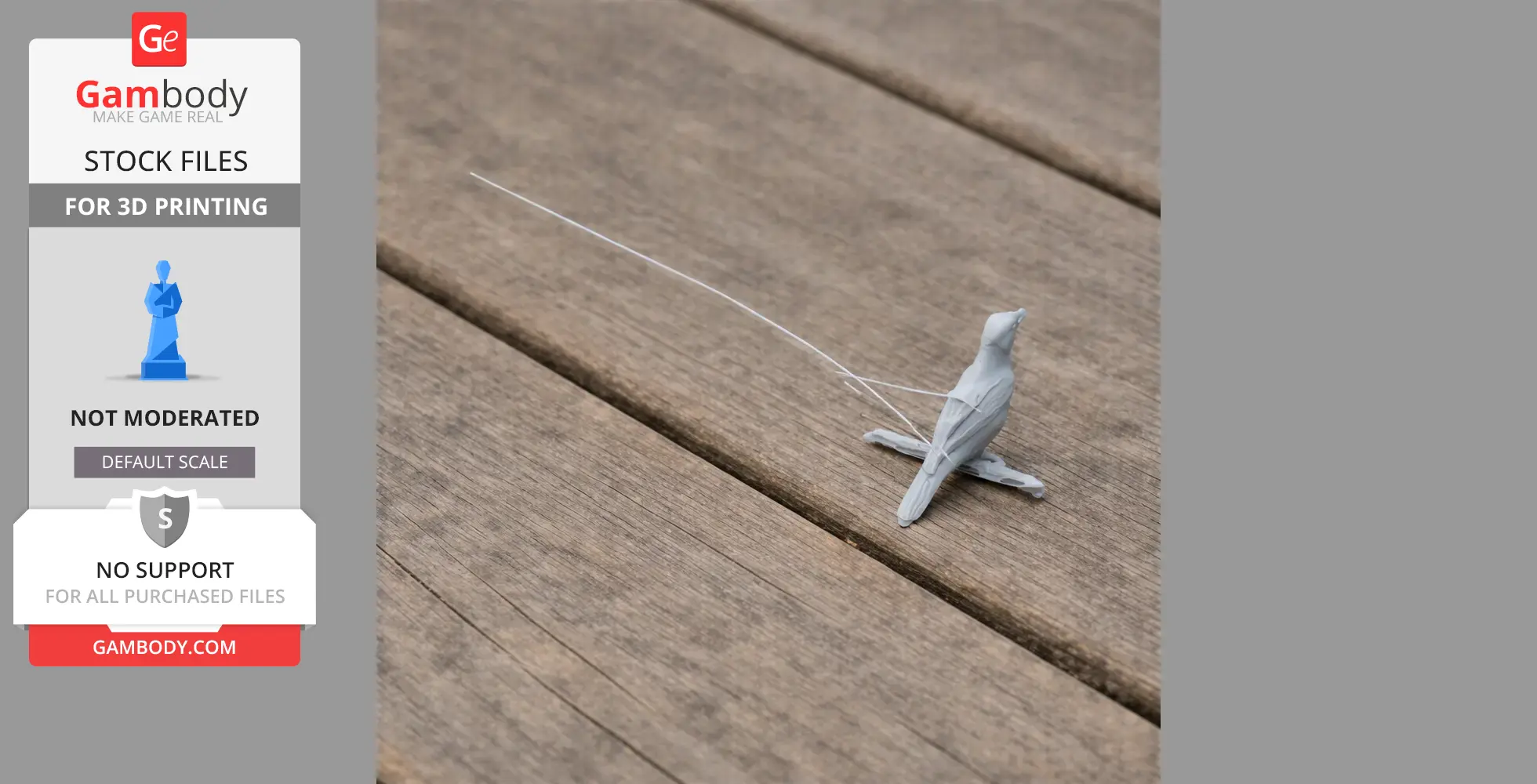 A small, gray 3D-printed bird model on a wooden surface.