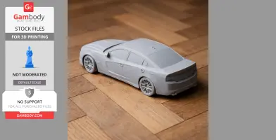 3D printed model of a Dodge Charger on a wooden floor.