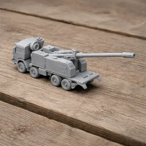 Gray 3D-printed model of a Nora B-52 tank with a long barrel on a wooden surface.