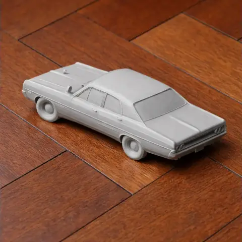 3D-printed scale model of a Dodge Polara, unpainted, on a wooden surface.