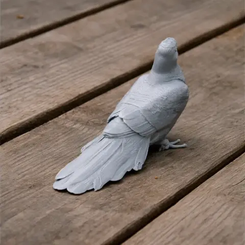3D printed model of a bar-tailed cuckoo-dove, detailed feathers, perched on a wooden surface.