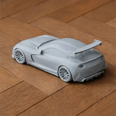 3D-printed Dodge Viper model with a prominent rear spoiler on a wooden surface.