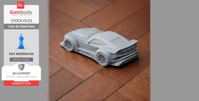 A 3D-printed, small-scale Donkervoort car model in gray, displayed on a wooden surface.