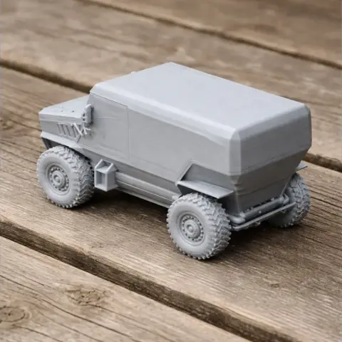 3D-printed model of an angular, armored vehicle with six rugged wheels on a wooden surface.