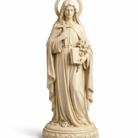 A statue of a saint holding a cross and book, adorned with a halo and robe, standing on a decorative base.
