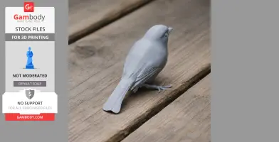 A gray 3D printed bird model on a wooden surface, detailed with feathers and perched stance.