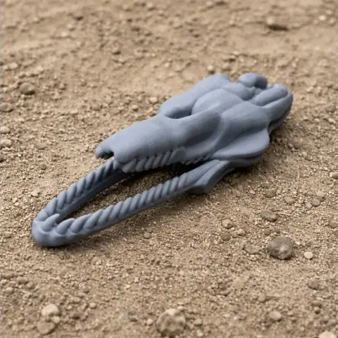 3D printed Yamatosaurus skull replica on a textured sandy surface.