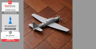 3D-printed model of Embraer EMB 314 Super Tucano on wooden surface.