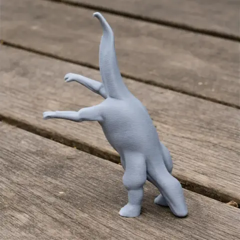 A 3D printed model of a Barosaurus standing on hind legs on a wooden surface.