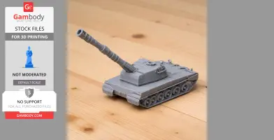 Gray 3D-printed model of Palmaria artillery tank on a wooden surface.