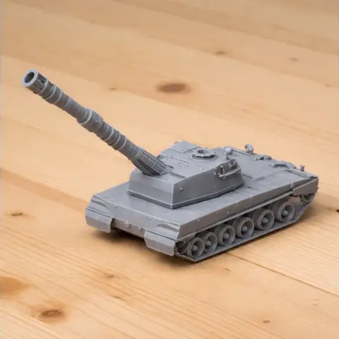 3D-printed Palmaria artillery tank model on a wooden surface.