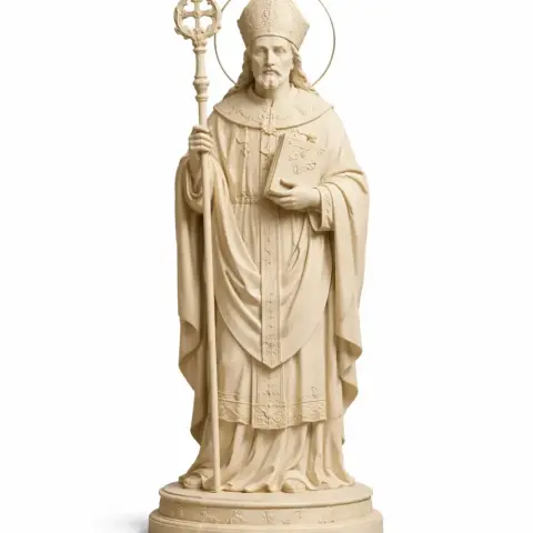 A detailed statue of a bishop holding a staff, wearing ornate religious robes and a mitre.