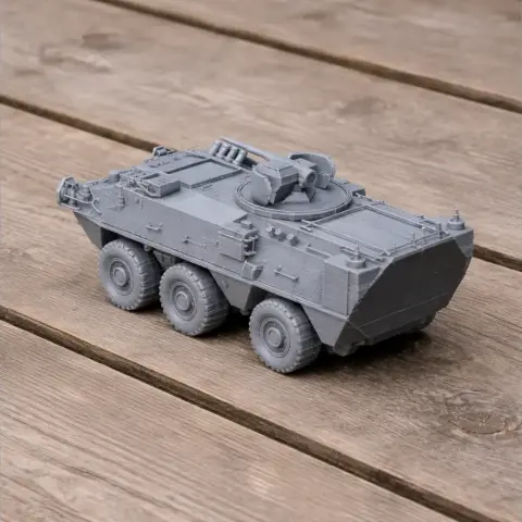 3D-printed Pandur I 6×6 tank model on wooden surface.
