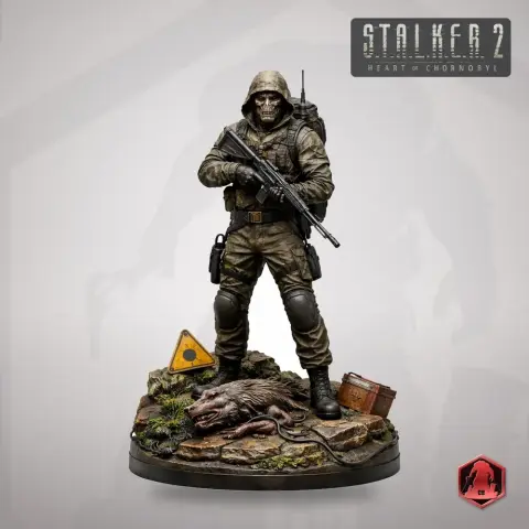 Armed figure in tactical gear stands on detailed base with rat, box, and warning sign. S.T.A.L.K.E.R. 2 theme.