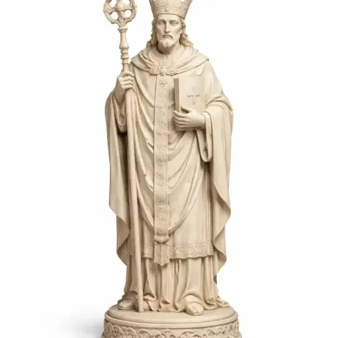 A detailed 3D model of a robed figure with a staff and book, wearing a mitre, on an ornate base.