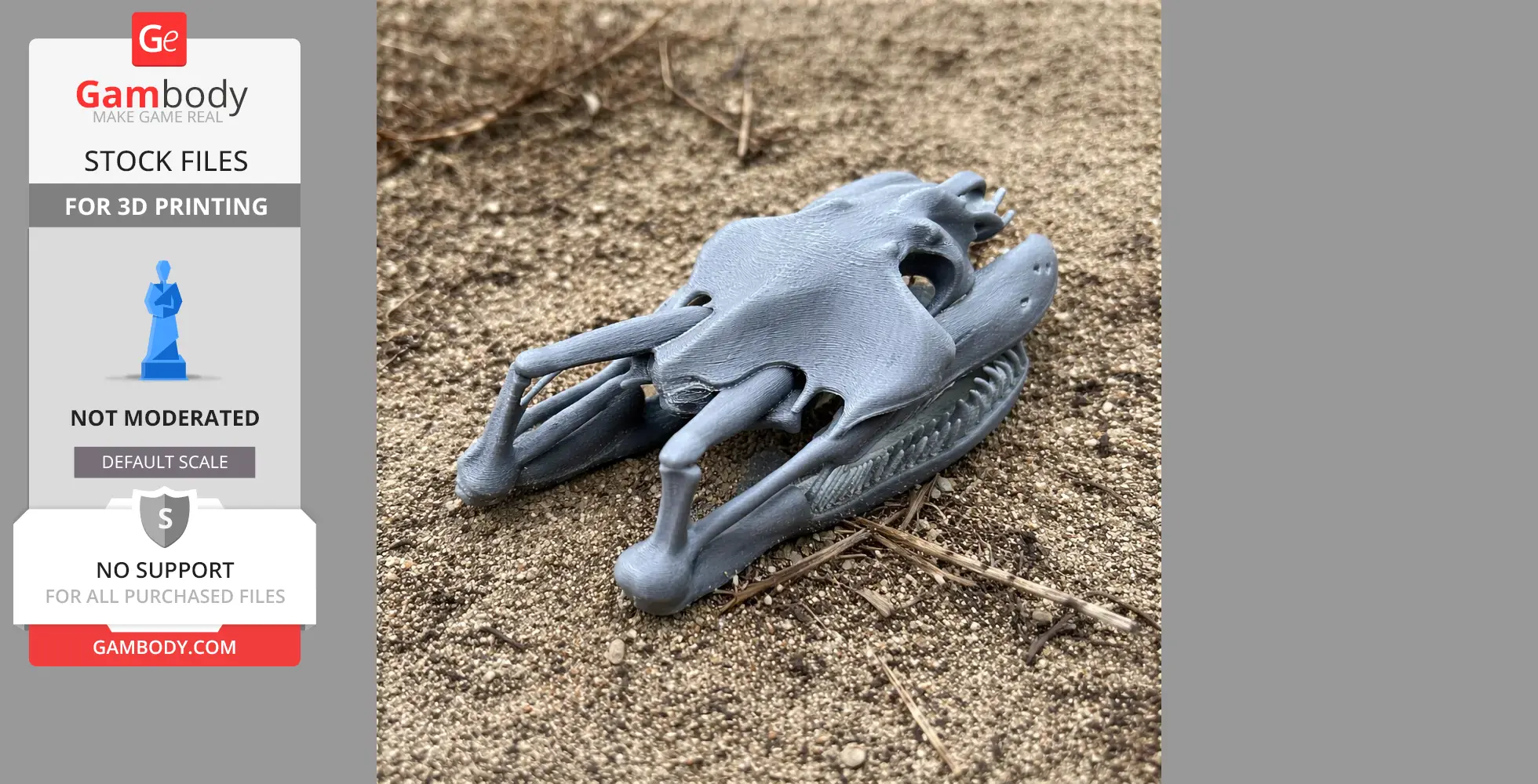 A detailed 3D-printed yellow anaconda skull replica lying on sandy ground.