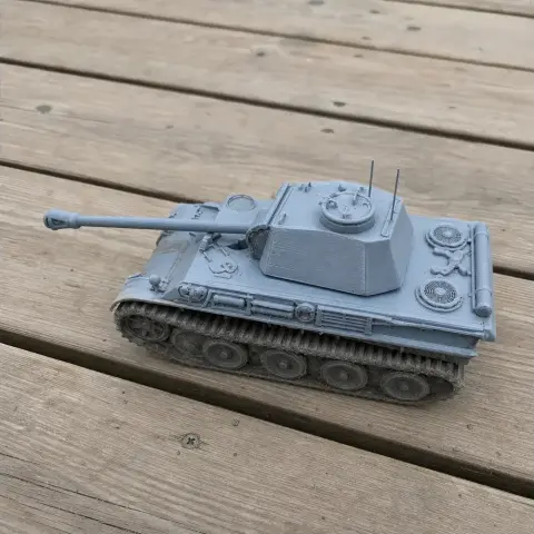 A detailed 3D-printed model of a Panther tank on a wooden surface.