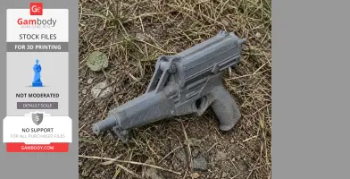 A gray 3D-printed Calico M950 cosplay prop gun resting on dirt and grass.