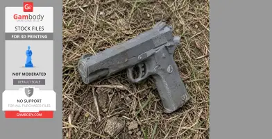 A 3D-printed Colt Delta Elite cosplay prop pistol resting on grass.